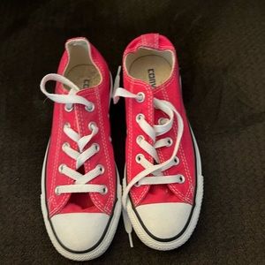 Woman’s hot pink converse